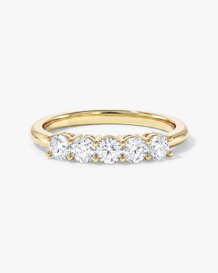 Round moissanite classic five stone anniversary band in yellow gold, front view