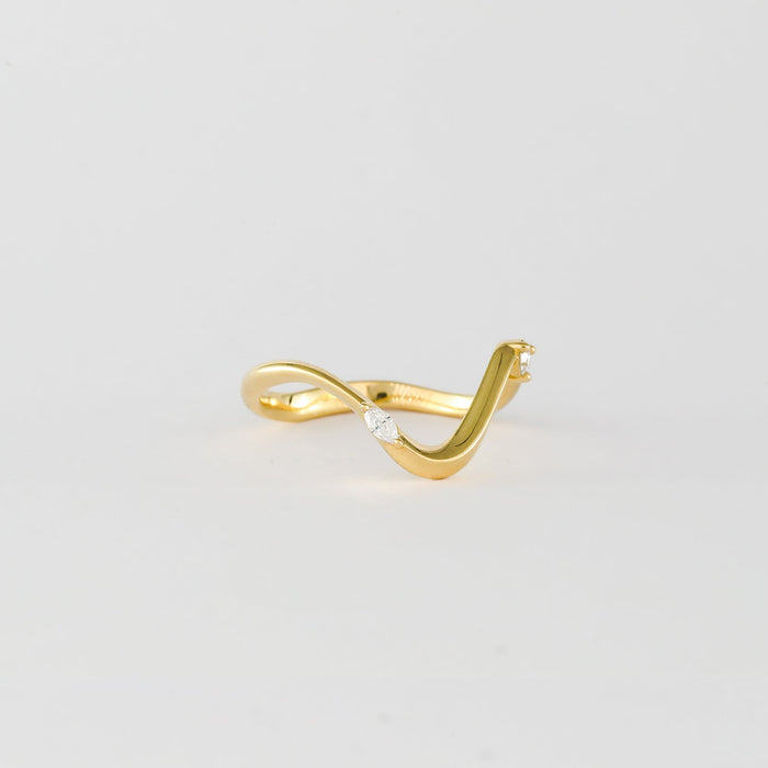 Curved wave wedding band with marquise and round moissanites, side view
