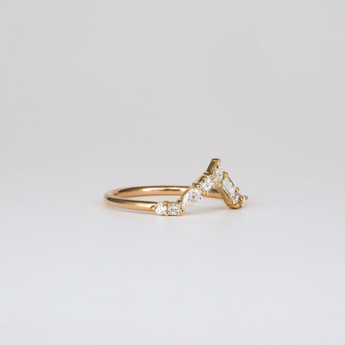 Mixed shape moissanite curved cluster wedding band, angled view