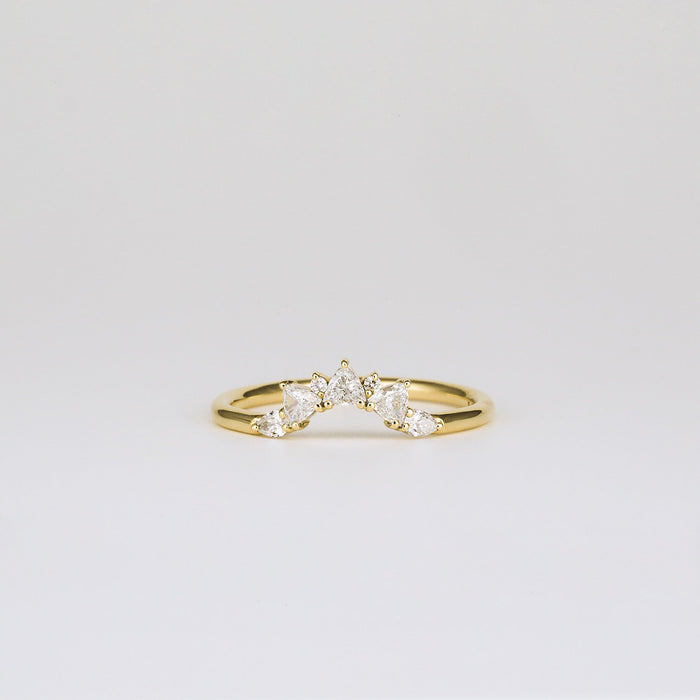 Round and trillion moissanite curved cluster wedding band in yellow gold, front view