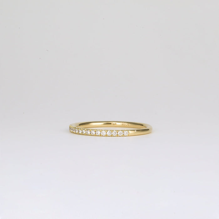 Round moissanite pave half eternity band, side view