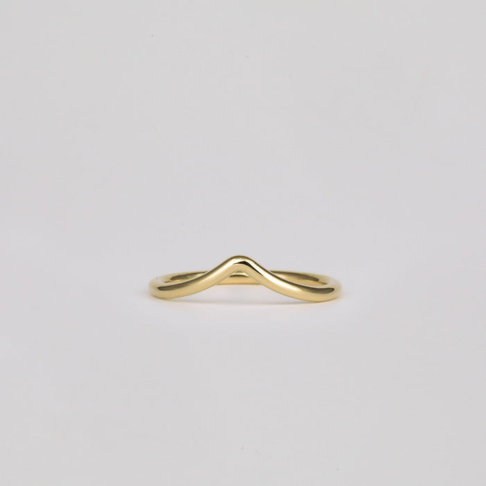 Plain V shaped curved wedding band in yellow gold, front view