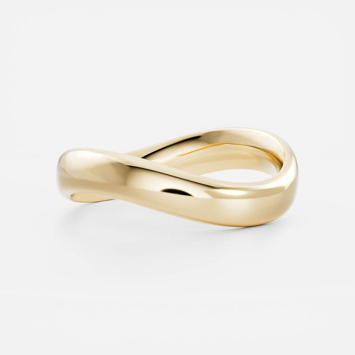 Plain curved wave wedding band in yellow gold, angled view