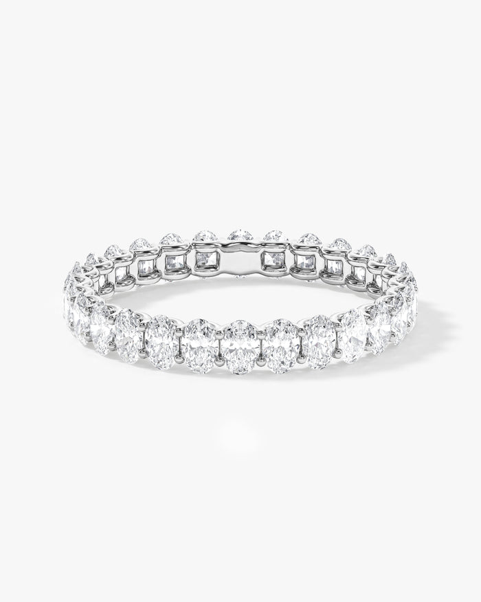 1.50 carat oval moissanite U-prong eternity wedding band in white gold