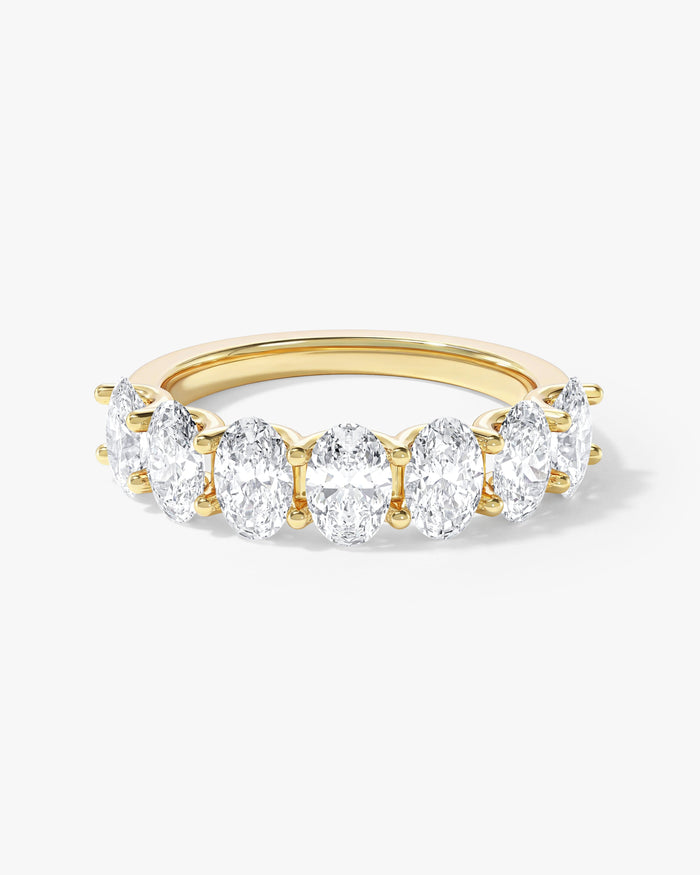 4.00 carat oval moissanite U-prong half eternity wedding band in yellow gold