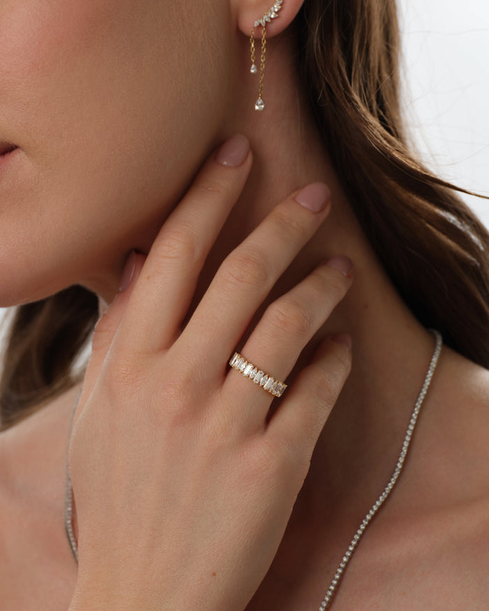Baguette and marquise moissanite band worn on a model's hand