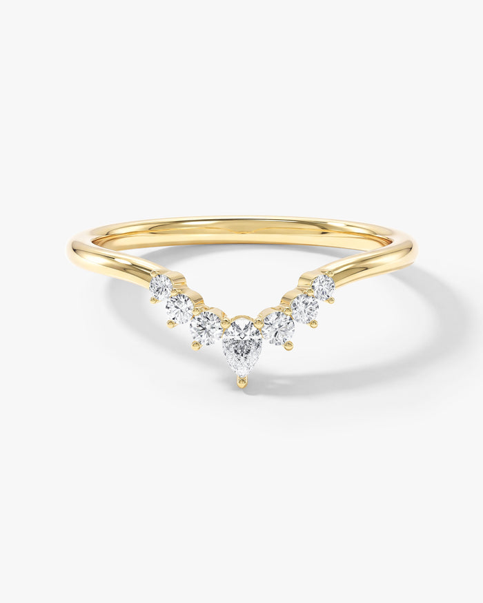 Pear and round moissanite crown curved nesting wedding band in yellow gold, front view