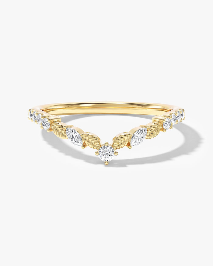 Petal floral curved nesting wedding band with marquise and round moissanite in yellow gold, front view