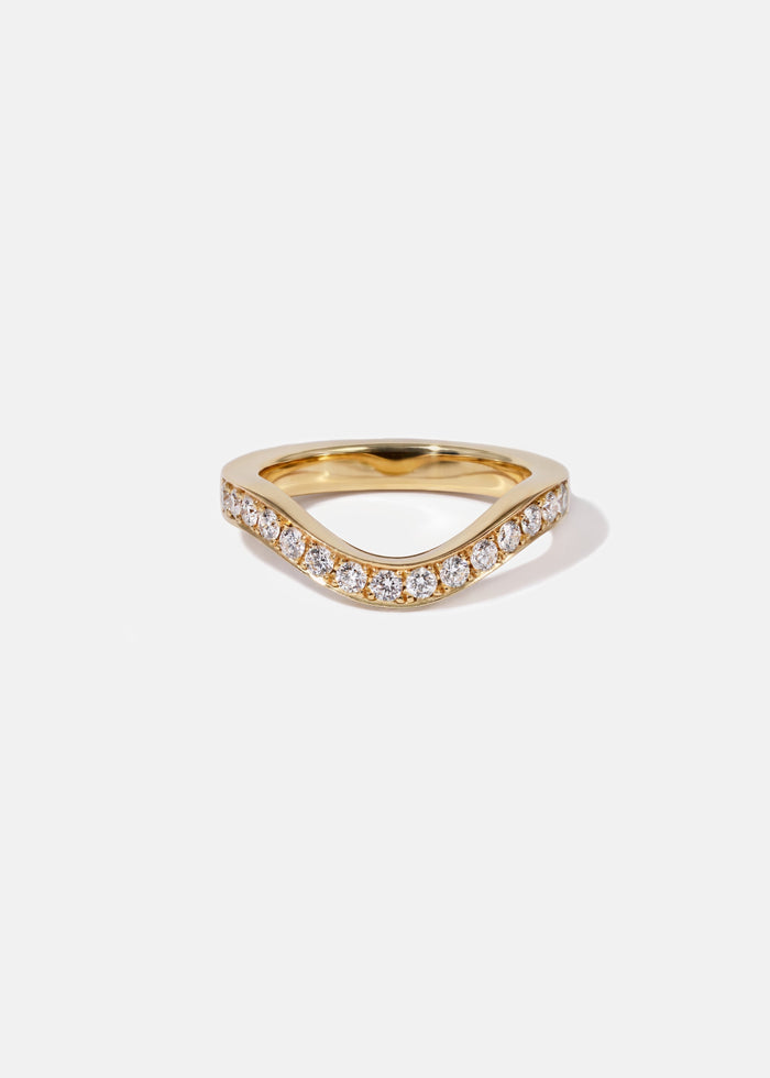 Round moissanite curved pave wedding band in yellow gold