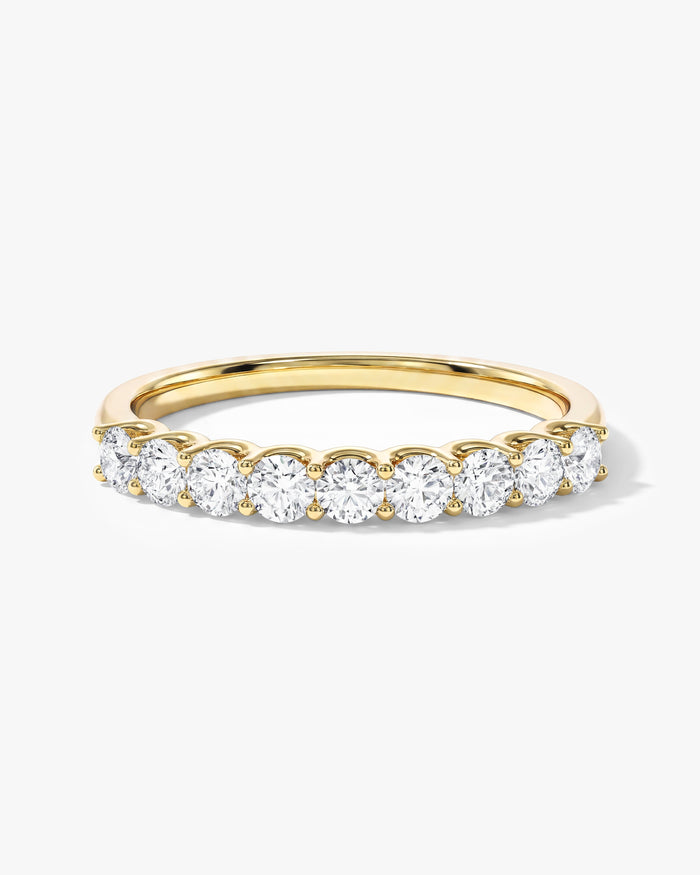 Round moissanite U-prong nine stone anniversary wedding band in yellow gold, front view