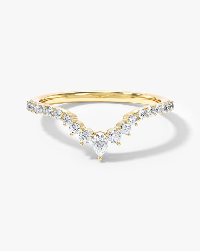 Tiara curved nesting wedding band with pear and round moissanite in yellow gold, front view