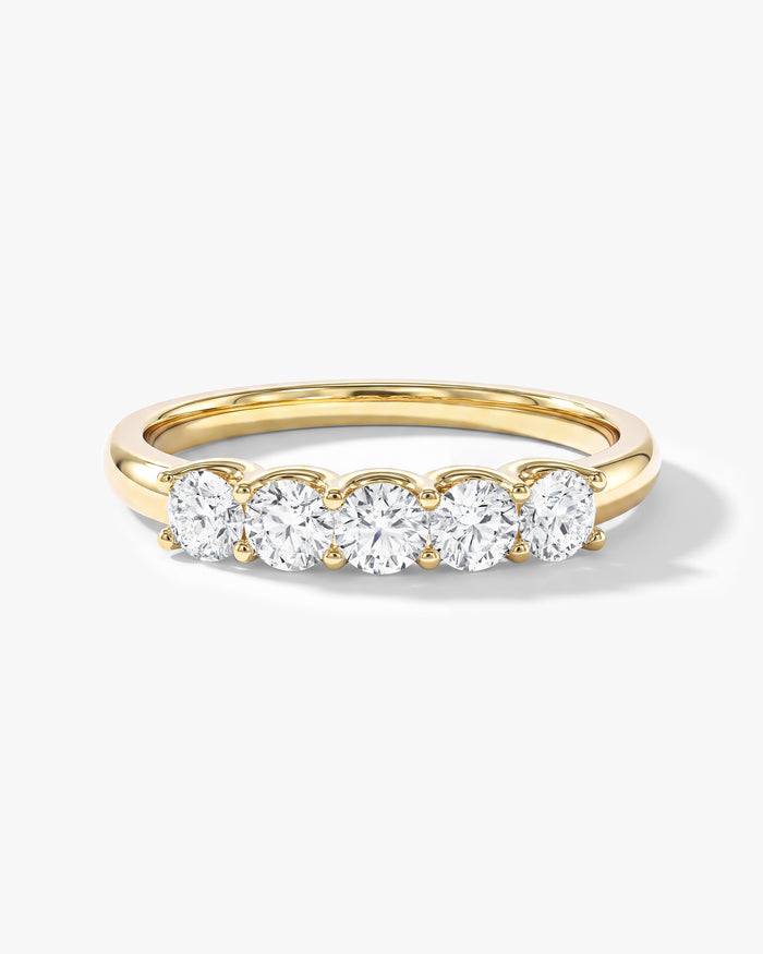 Round moissanite U-prong five stone anniversary wedding band in yellow gold, front view