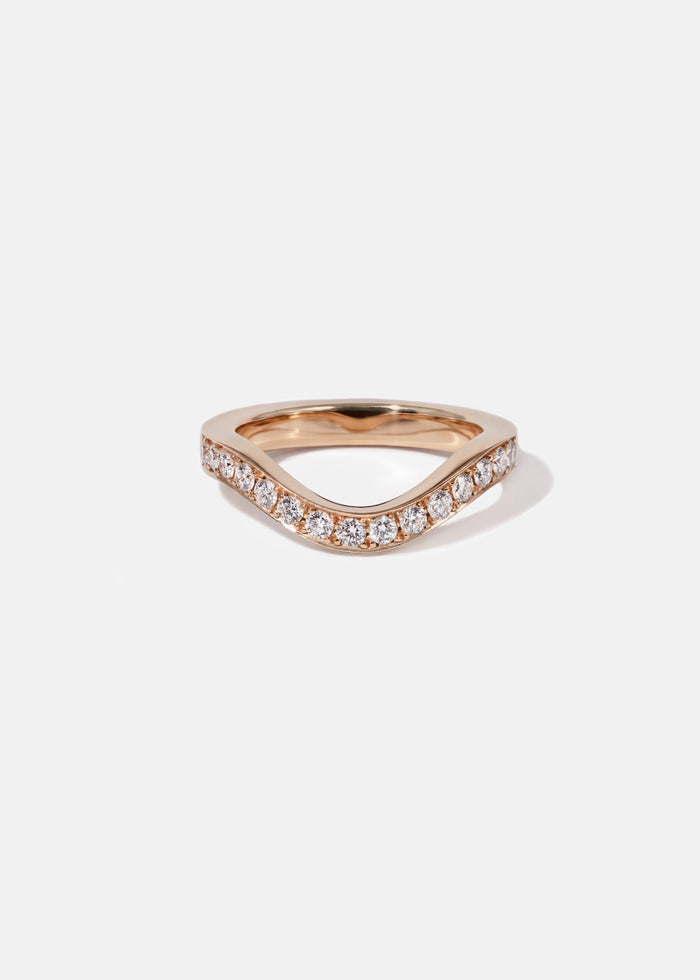 Round moissanite curved pave wedding band in rose gold