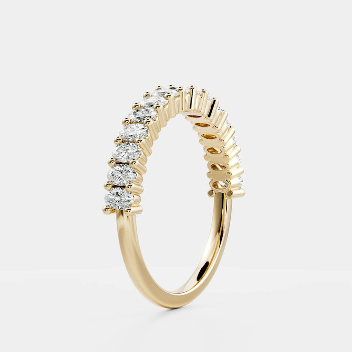 Oval moissanite half eternity wedding band in yellow gold, side view