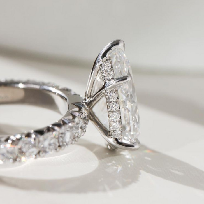 Elegant pear shaped moissanite wedding ring, angled view