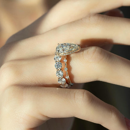 East west pear cut lab grown diamond bridal ring set with a shared prong diamond band in rose gold