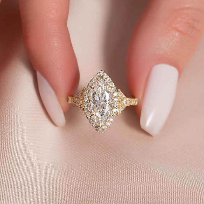 Marquise cut lab grown diamond navette halo ring with milgrain in yellow gold