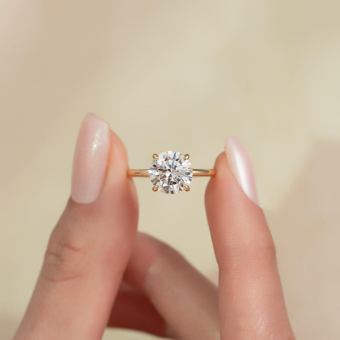 Round brilliant moissanite solitaire on thin band