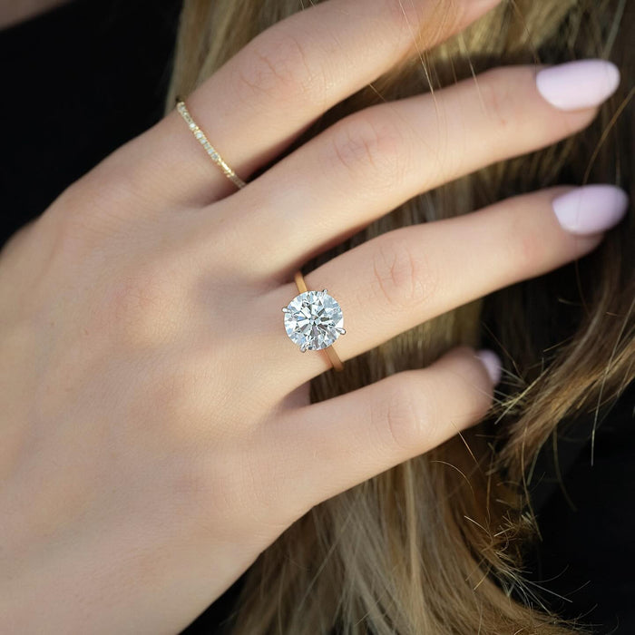 Two tone head and shank of the round brilliant solitaire ring