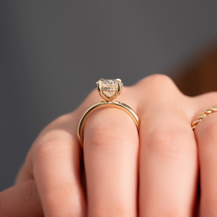 Profile of oval moissanite hidden halo engagement ring