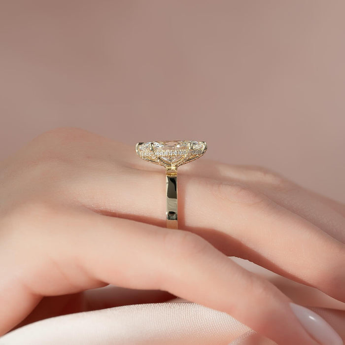 Marquise moissanite hidden halo ring profile in yellow gold