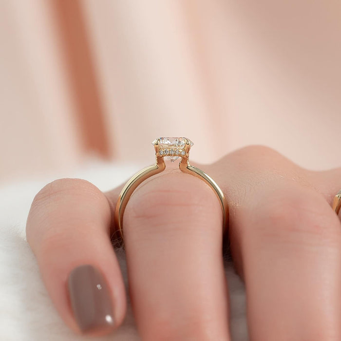 Round moissanite hidden halo solitaire ring profile in yellow gold