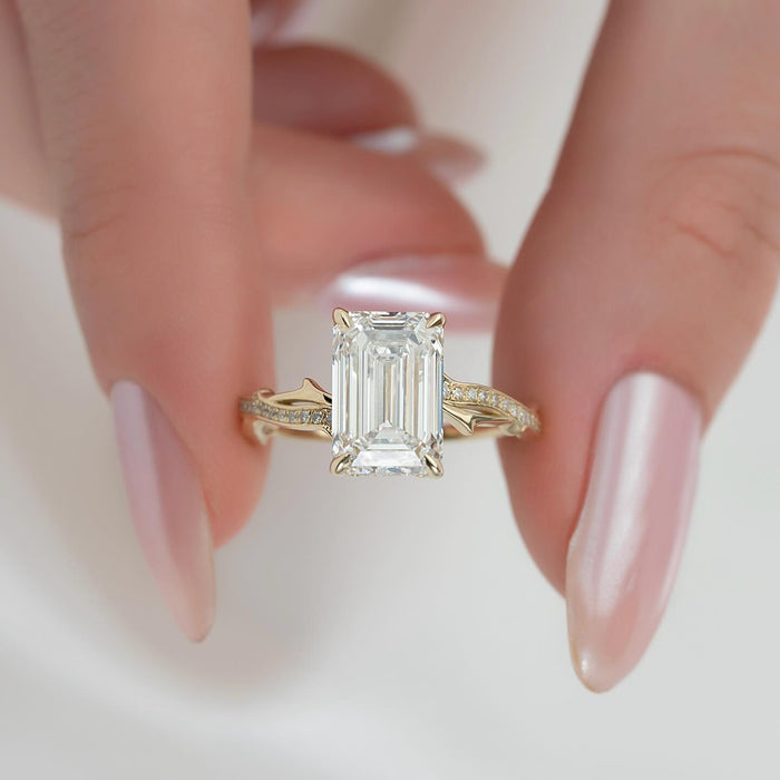 Emerald cut moissanite hidden halo twisted band ring detail