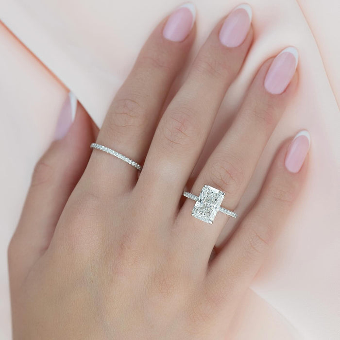 Radiant cut lab grown diamond ring in white gold on a fine micro pave shank worn on the hand