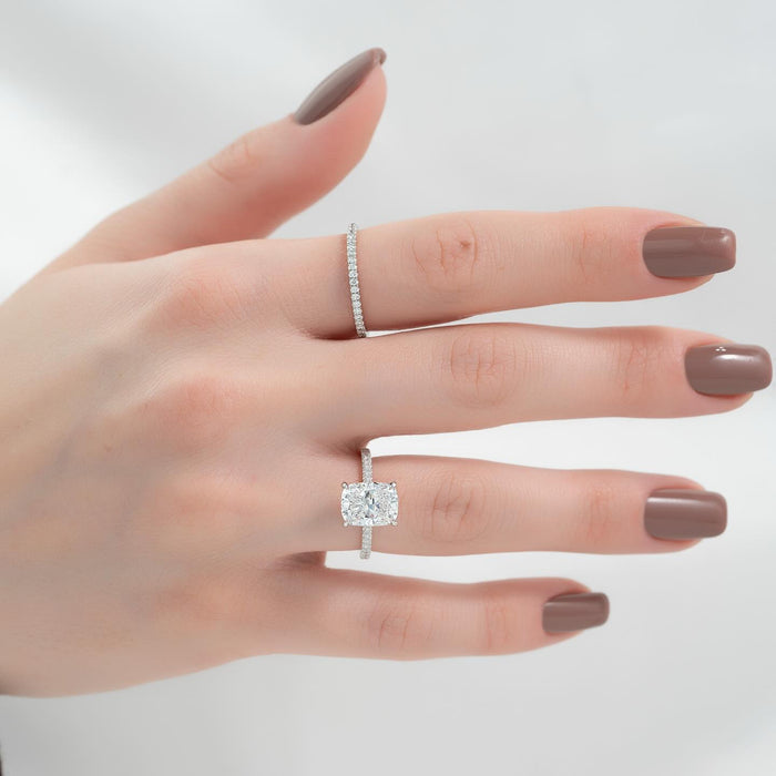 Pave hidden halo beneath the elongated cushion centre diamond