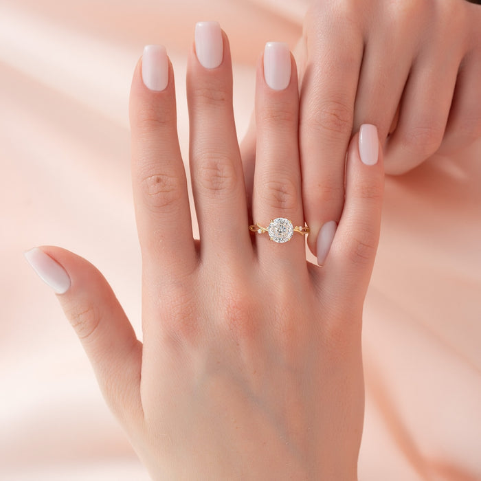 Round cut lab grown diamond ring with split wishbone shank in yellow gold worn on the hand
