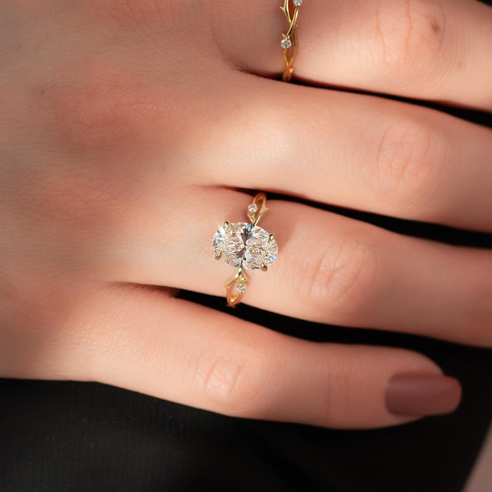Bow shaped shoulder detail with a single accent diamond
