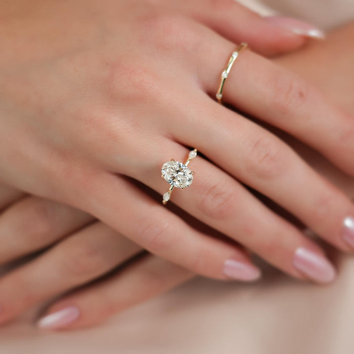 One marquise accent diamond set into each shoulder of the band