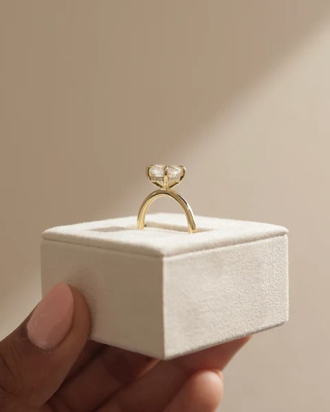 Cushion cut solitaire shown in profile with a plain unadorned shank