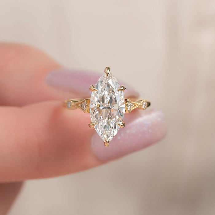 Marquise cut lab grown diamond vintage ring with milgrain and bezel set accents, front view
