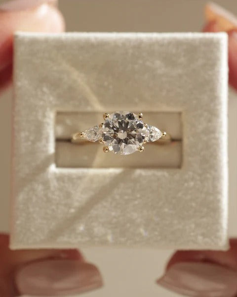 Round lab grown diamond trilogy ring with pear sides side profile