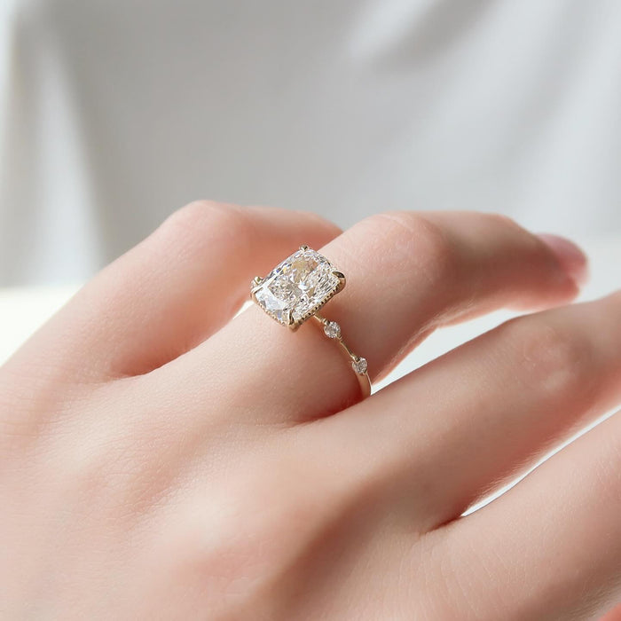 Close view of the sparse accents along the fine shank of the cushion cut ring