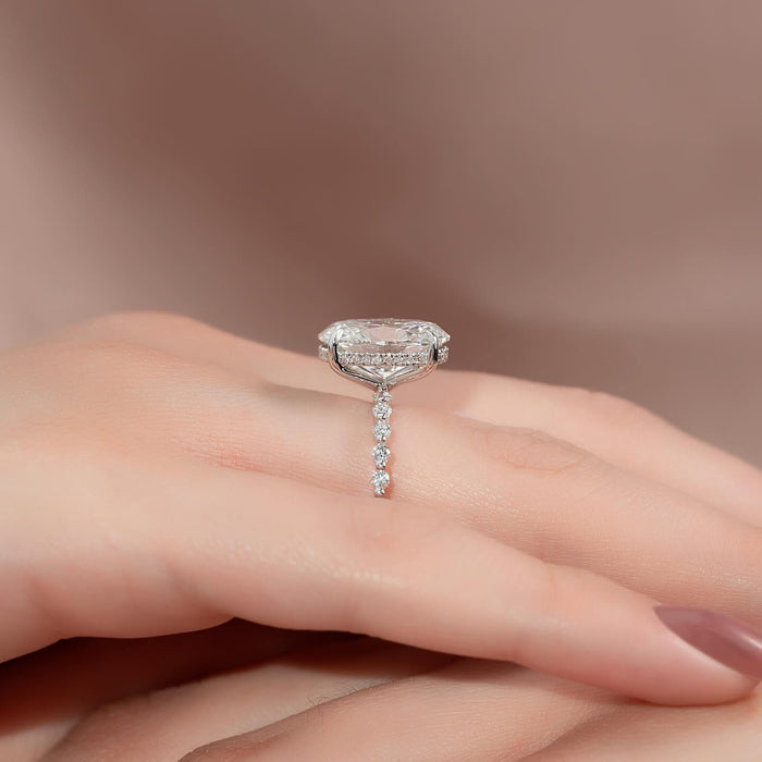 Double row pave hidden halo beneath the oval centre diamond