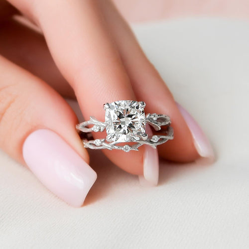 Cushion cut lab grown diamond engagement ring on a carved twig band stacked with a matching twig wedding band