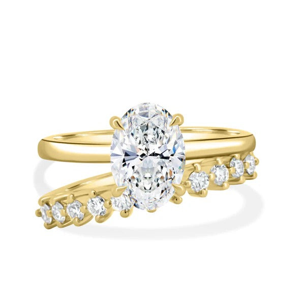 Oval diamond engagement ring and matching wedding band stacked