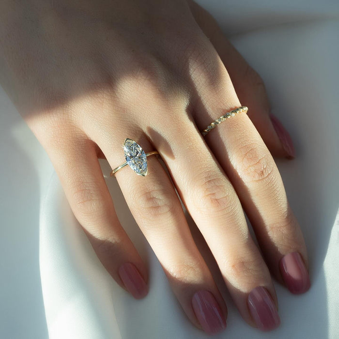 Marquise diamond solitaire ring worn on the hand