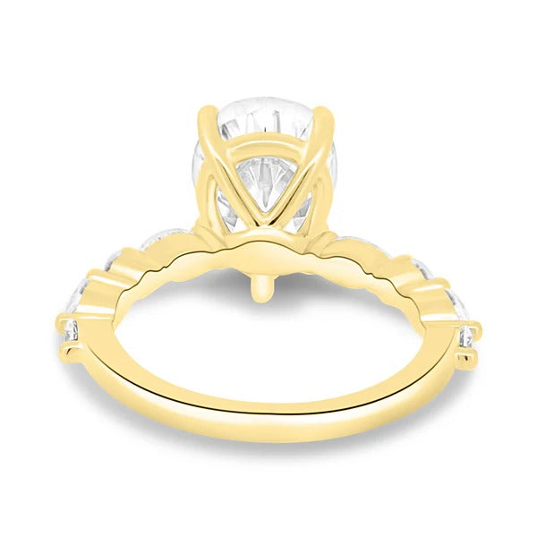 Pear cut lab grown diamond ring with alternating round and marquise accent band