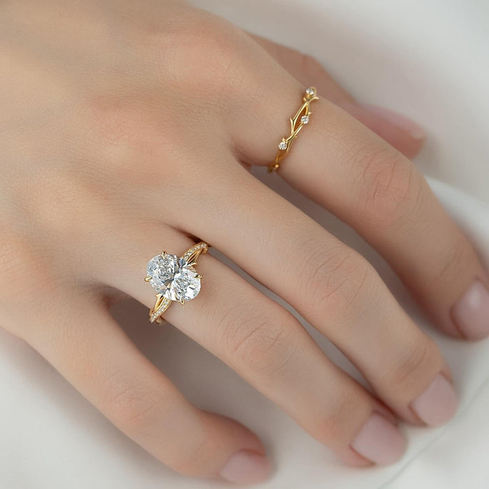 Oval lab grown diamond ring showing the two strands winding around the band