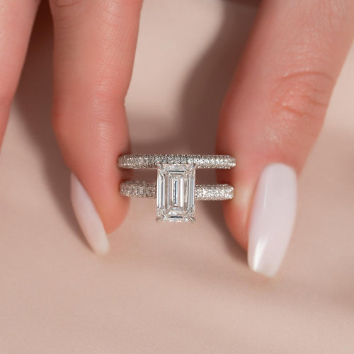 Side view of the bridal set showing pave wrapping the outer walls of both bands