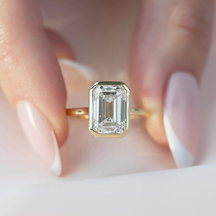 Profile showing the pave halo rail around the bezel and the diamond set bridge beneath the head
