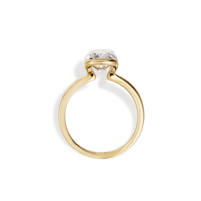 Side profile of an elongated old mine cut lab grown diamond in a half bezel setting