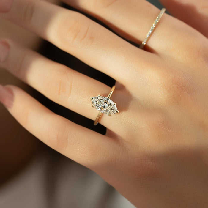 Marquise diamond solitaire engagement ring worn on the hand