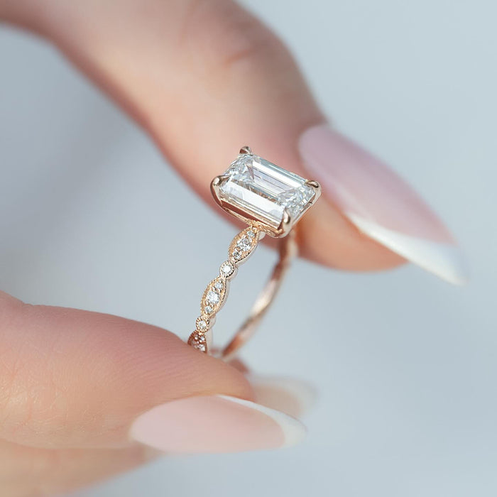 Angled view showing the milgrain edged marquise stations running around the shank