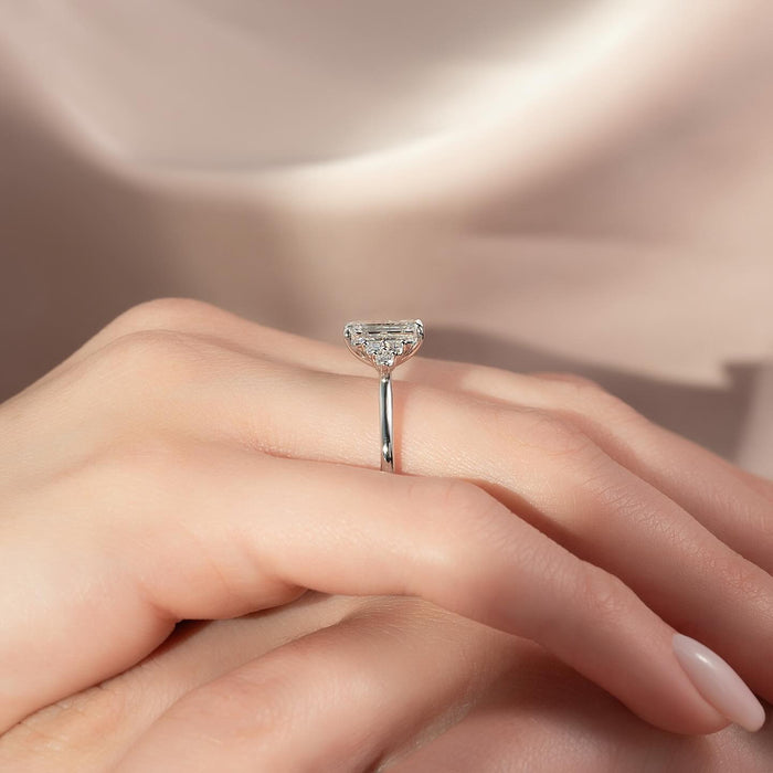 Side profile of the low set east west emerald cut diamond