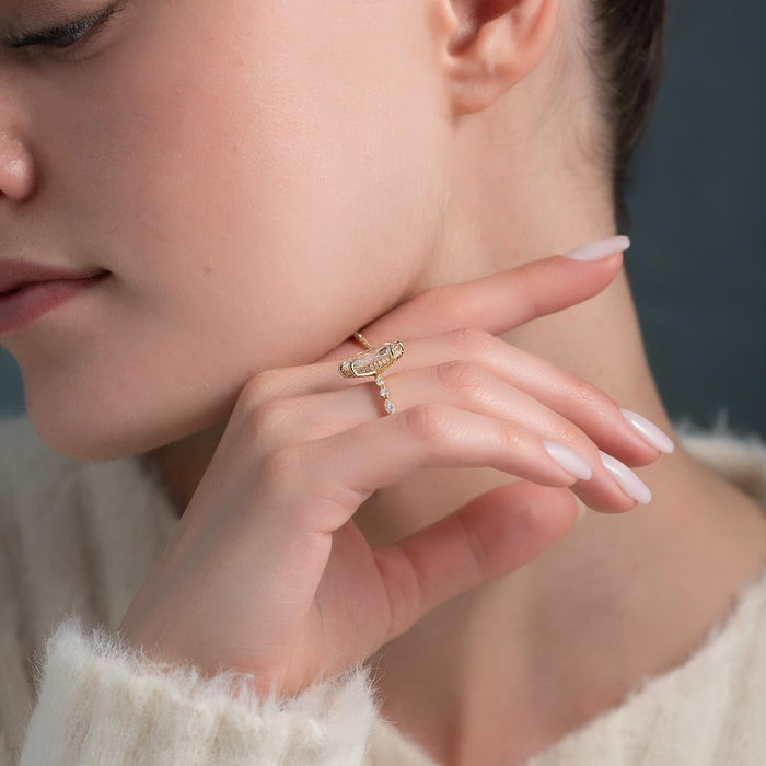 Pave hidden halo beneath the marquise centre diamond