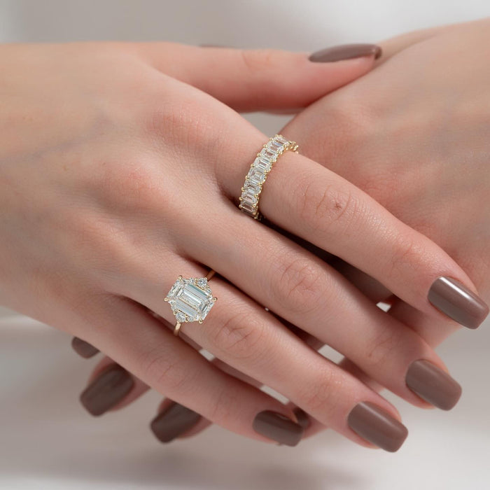 Trapezoid and kite cut accent diamonds forming the geometric halo